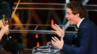 Eddie Redmayne accepts the Oscar for best actor during the 87th Academy Awards in Hollywood.