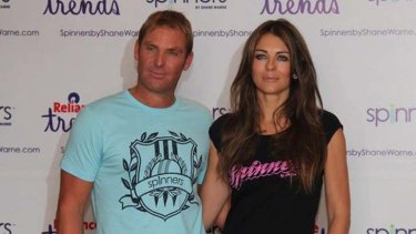 Glamour for a cause ... Shane Warne and Liz Hurley promote Warne's charity auction.