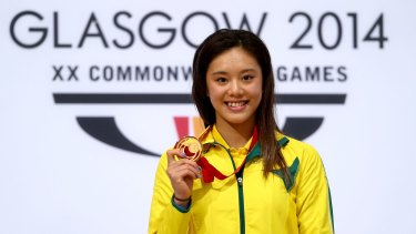 Esther Qin of Australia with her gold medal after winning the 3 metre springboard final at the Royal Commonwealth Pool at the  Commonwealth Games.