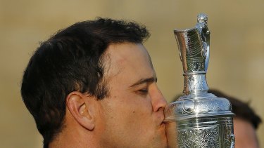 American Zach Johnson he kisses the Claret Jug after winning the British Open.