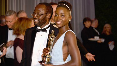 Proud moment ... Mexican-born Kenyan refugee Lupita Nyong'o with her little man (Oscar) and her father Peter Anyang' Nyong'o.