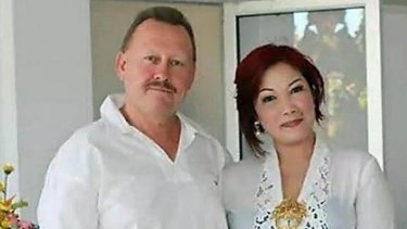 Killed in Bali: Robert Kelvin Ellis, pictured with his wife Julaikah Noor Aini, was found with his throat slashed.