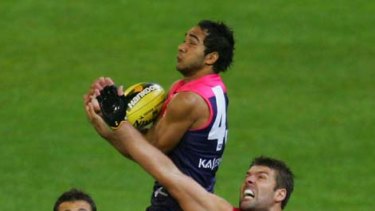 Melbourne's Jamie Bennell flies high but the Bulldogs came out on top at the MCG last night.