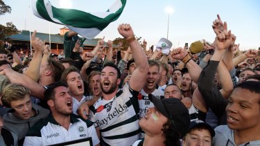 Alive and well: Warringah players and fans celebrate their Shute Shield success.