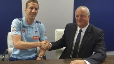 Welcome aboard: New recruit Marc Janko with Sydney FC coach Graham Arnold.