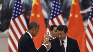Historic deal: Barack Obama and Xi Jinping toast at an APEC lunch.