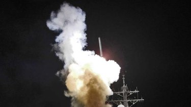 Arleigh Burke-class guided-missile destroyer USS Barry (DDG 52) launches a Tomahawk missile in support of Operation Odyssey Dawn on Saturday.