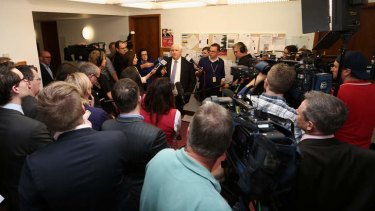 Clive Palmer holds a press conference in the Parliament House press gallery on Monday.