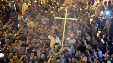 Coptic Christians shout slogans after the funeral service of some of the victims of a bus attack.carrying Christians, many of them children, on their way to a remote desert monastery has risen to over 20. ?(AP Photo/Amr Nabil)