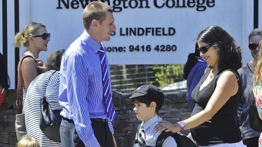 Family ties ... Chris Wyatt, head of Newington College Lindfield K-6, speaks with parents outside the school. The college enables parents to study the same language their children are learning.