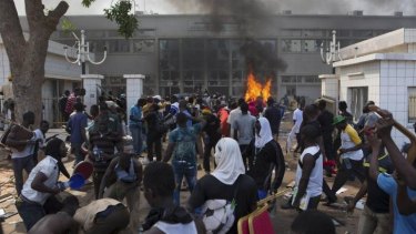 Set ablaze: Protesters set fire to the parliament building.