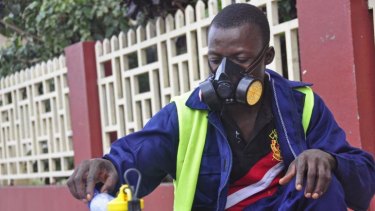 An employee of the Monrovia City Corporation mixes disinfectant before spraying it on the streets in a bid to prevent the spread of the deadly Ebola virus.