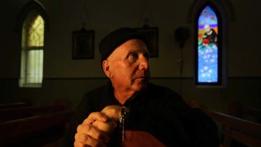Illuminating ... Salvatore Zofrea in front of one of the eight stained glass windows he is making for St Gregory's Church in Kurrajong.