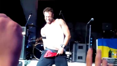 Airing too much dirty laundry ... Bloodhound Gang bassist Jared Hasselhoff pulls the Russian flag through his pants onstage in the Ukraine.