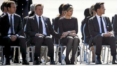 King Willem-Alexander and Queen Maxima (centre) mark the return of MH17 victims at Eindhoven.
