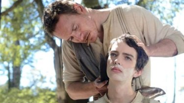 Close: Gunman Silas (Michael Fassbender) becomes the protector of Jay Cavendish (Kodi Smit-McPhee) in <i>Slow West</i>.