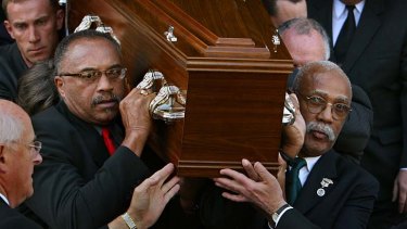 US athletes Tommie Smith,  left,  and John Carlos carry Peter Norman's coffin from the Williamstown Town Hall on  October 9, 2006.