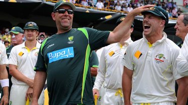 Australian coach Darren Lehmann shares a joke with David Warner after the Ashes were regained.