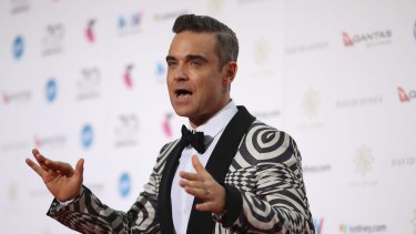 Robbie Williams avoided the downpours at the ARIA Awards in Sydney on Wednesday.