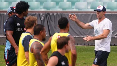 Words of wisdom: Brad Fittler passes on tips to the Waratahs during a training session on Tuesday.