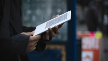 At the bus stop ... Amazon's Kindle e-book reader.