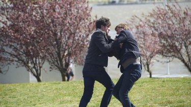 ABC TV political thriller The Code will return for a second season. Hacker Jesse Banks, played by Ashley Zukerman, wrestles with AFP officer Lyndon Joyce, Dan Wyllie, on the shores of Lake Burley Griffin. 