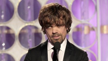 'Google him' ... Peter Dinklage accepts the Golden Globe for Best Supporting Actor yesterday.