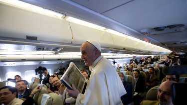 Speaking his mind again ... Pope Francis attends a press conference aboard a plane during his trip to the Philippines.