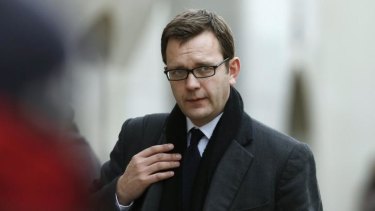 Former <i>News of the World</i> editor Andy Coulson arrives at the London's Old Bailey courthouse where he was accused of covering up phone hacking by former reporter Dan Evans.