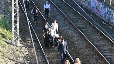 Oaks Day commuters are forced to walk the line after a rail fault.