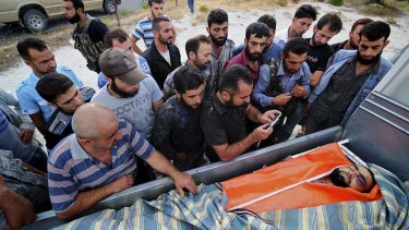 The body of Mohammed Aziz Mehho is brought home to Tertyah, where a speedy burial will take place to avoid Syrian army attacks.