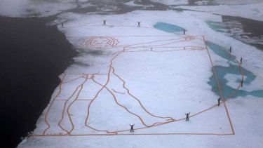 Art for action ... the artist John Quigley recreated Leonardo da Vinci's Vitruvian Man on ice to highlight the melting Arctic.