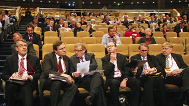 Stripped-down, pared-back, deliberately drab  ... Simon Crean, third from left, talks to the ALP national conference delegate Gerard Dwyer in Sydney yesterday.
