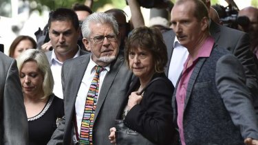 Rolf Harris arrives for sentencing with his daughter Bindi (left) and niece Jenny.