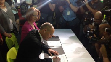 Signed... Premier Campbell Newman and PM Julia Gillard agree on the NDIS.