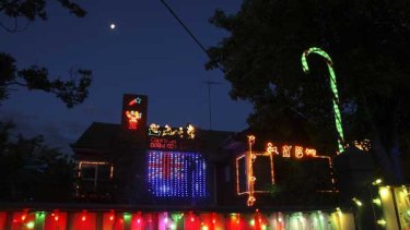 Tim Wells's broadcasts of Christmas carols, and his illuminated house, draw the neighbours. "When the lights are on at night and the music is on, people stop and talk."