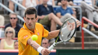 High times: Novak Djokovic of Serbia hits a return against Jeremy Chardy of France during day six of the Rogers Cup.