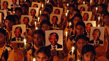 World in mourning: Schoolchildren in Chennai, India, held prayers to mark the death of Nelson Mandela.