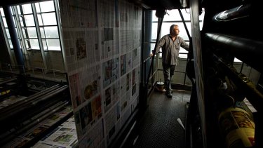 End of an era: Greg Dewstow at the Chullora printing press on its last night of printing. The press will be sold off as scrap metal.