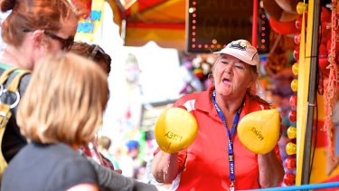 Roll up, roll up: Karen Ridgeway works the crowd at the Royal Melbourne Show.