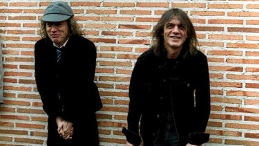 Malcom Young (right) is suspected of being in too poor health to continue with AC/DC .. Younger brother Angus Young, left, is also in the iconic  rock group.