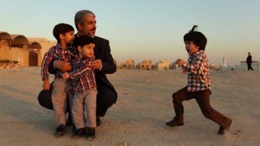 Khalid Mishal plays with his grandsons in Doha, Qatar.