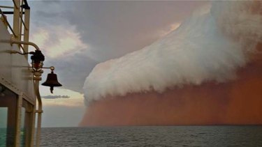 A wall of dust and water whipped up by cyclone Narelle.