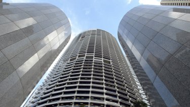 The Grosvenor Place skyscraper towers over entrance columns and the complex's courtyard in central Sydney.