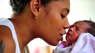  A new mother and her baby at the maternity ward at Port Moresby General hospital.