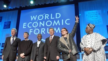 At Davos in 2005 are )from left) Bill Clinton, Microsoft's Bill Gates, South Africa's Thabo Mbeki, British PM Tony Blair, Irish rock star Bono and Nigerian President Olusegun Obasanjo. 