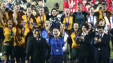 Australian women soccer team players celebrate during a trophy presentation ceremony after they defeated North Korea in the Final match of the AFC Women's Asian Cup.