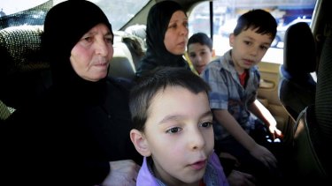 Syrian refugees cross from Syria into Lebanon by the carload.