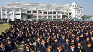 Children gather in front of the City Montessori School in Lucknow.