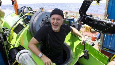 Prepare to dive: James Cameron emerges from the submersible after reaching the bottom of the Mariana Trench.